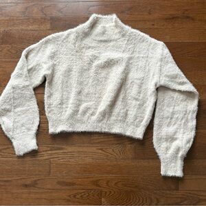 Woman’s cropped fuzzy sweater